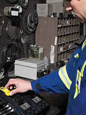 Worker docking a detector in a dock